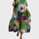 Türkises Kleid mit Blütenmuster