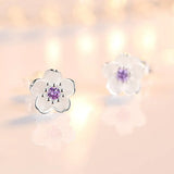 Boucles d'oreilles à bouton en forme de fleur avec zirconiums