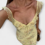 Gelbes Maxikleid mit floralem Druck und V-Ausschnitt